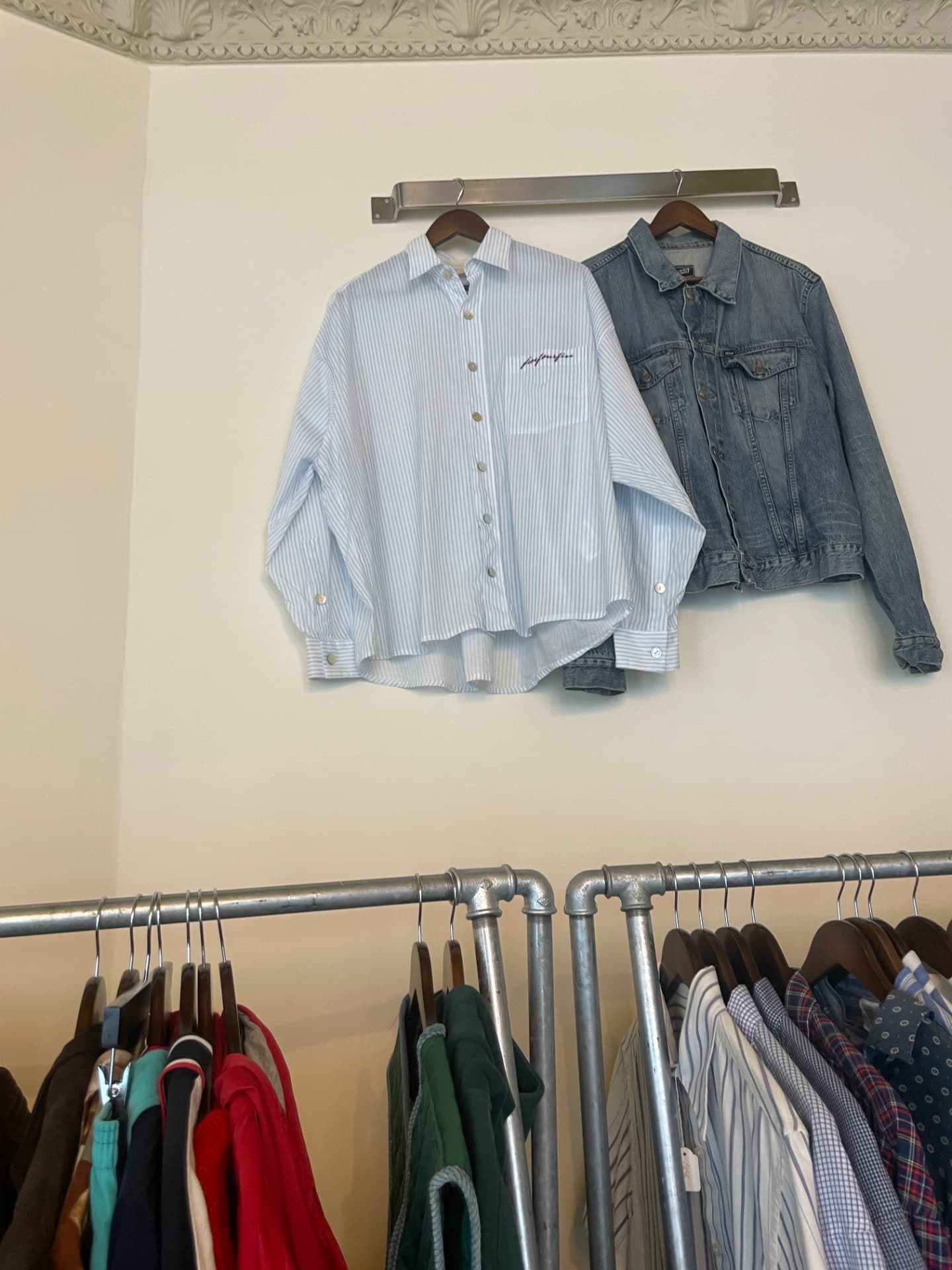 The picture taken in the shop of a light blue striped shirt